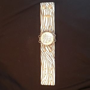 Plunder faux leather cuff with detachable pendant